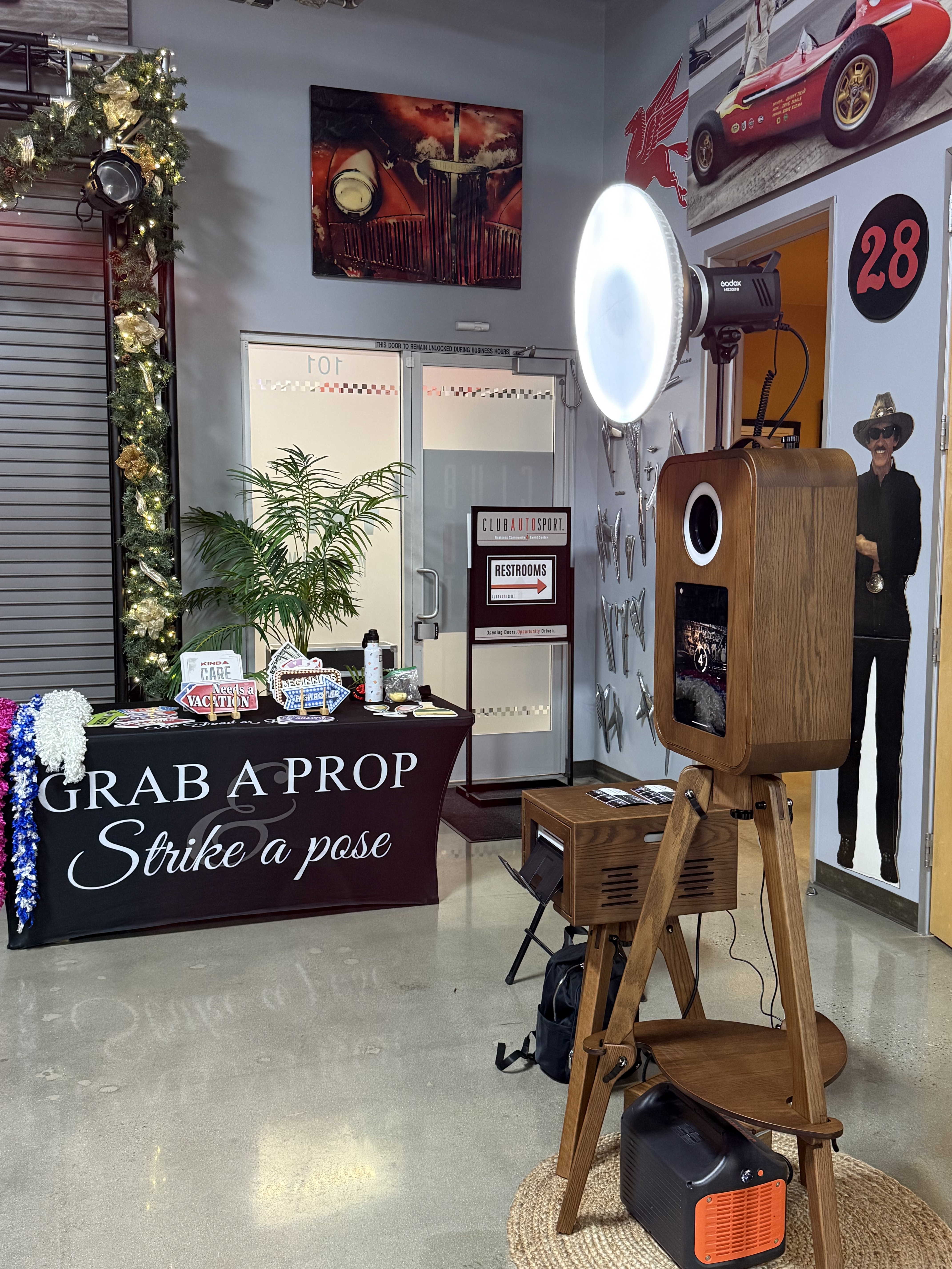 Vintage photo booth set up at an event with prop table